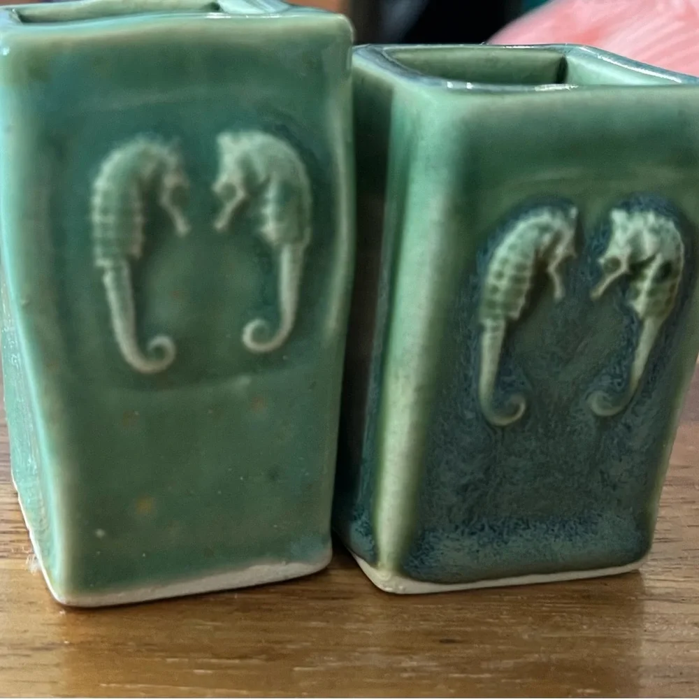 Small ceramic vases with seahorse detail. Green